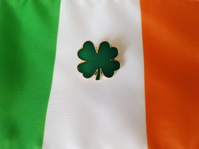 Clover enamel pin on Irish flag (centered)